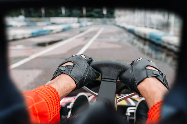 Hands of karting driver on steering wheel — Stock Photo, Image