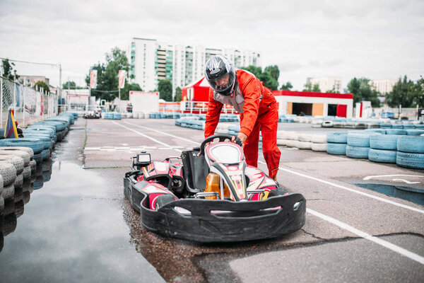 Karting racer on speed track