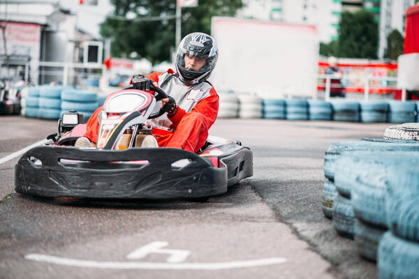 Karting racer wearing helmet 