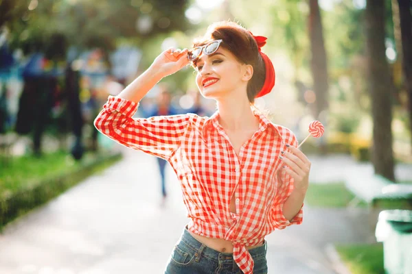 Young woman with pin-up makeup and hairstyle — Stock Photo, Image