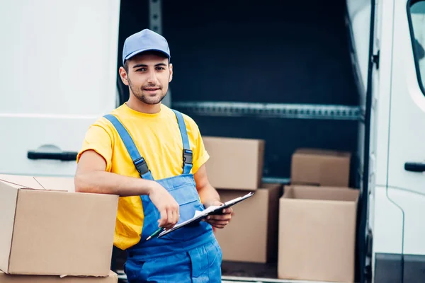 Male courier in uniform — Stock Photo, Image