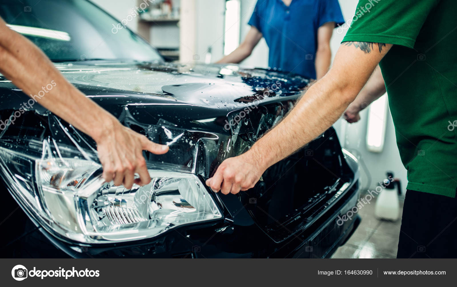 Workers installing car protection film Stock Photo by ©Nomadsoul1 164630990