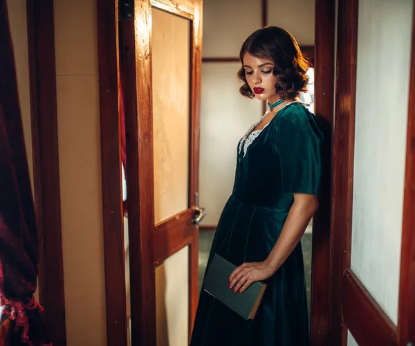 Young woman travelling in retro train — Stock Photo, Image