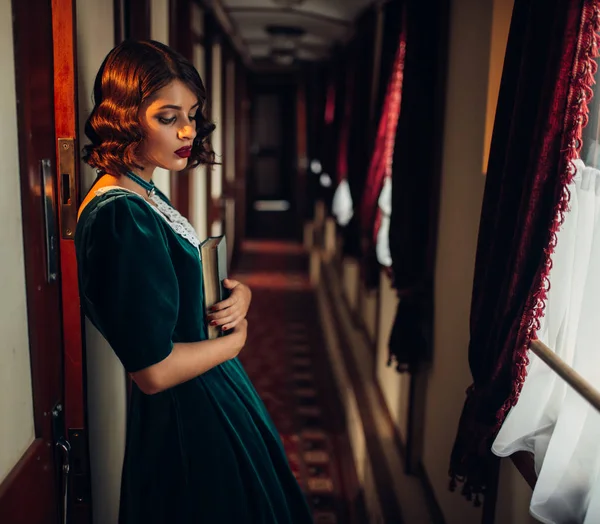 Young woman travelling in retro train — Stock Photo, Image