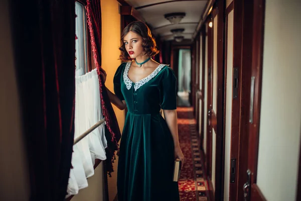 Young woman travelling in retro train — Stock Photo, Image