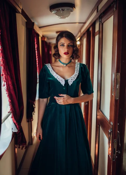 Young woman travelling in retro train — Stock Photo, Image