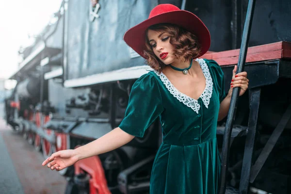 Young woman against old railway wagon — Stock Photo, Image