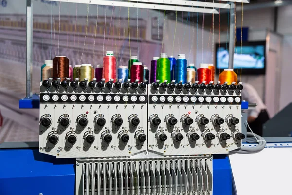 Spools of threads on spinning machine — Stock Photo, Image