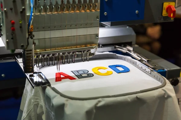 Sewing machine making embroidery — Stock Photo, Image
