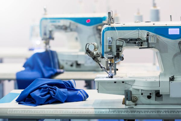 Professional sewing machine and blue textile
