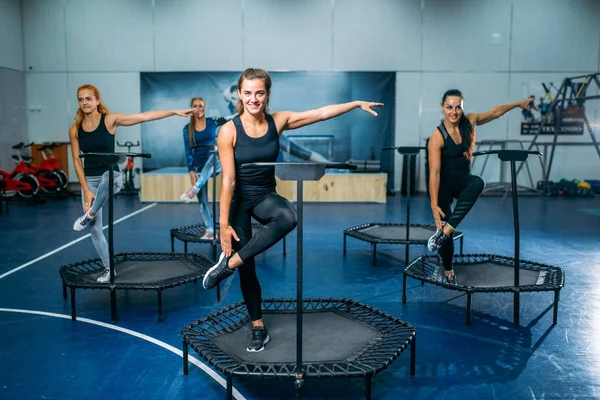 women exercising on trampolines