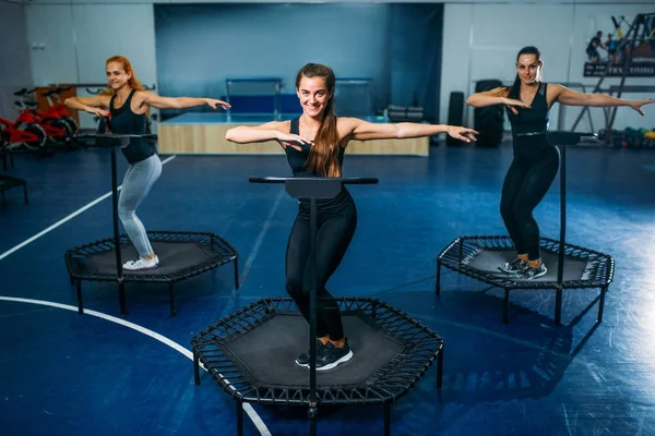 women exercising on trampolines