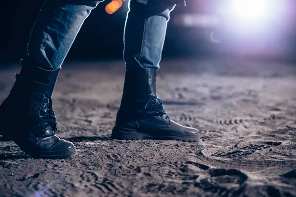 Closeup Man Wearing Leather Boots Night Car Lights Background Horror — Stock Photo, Image