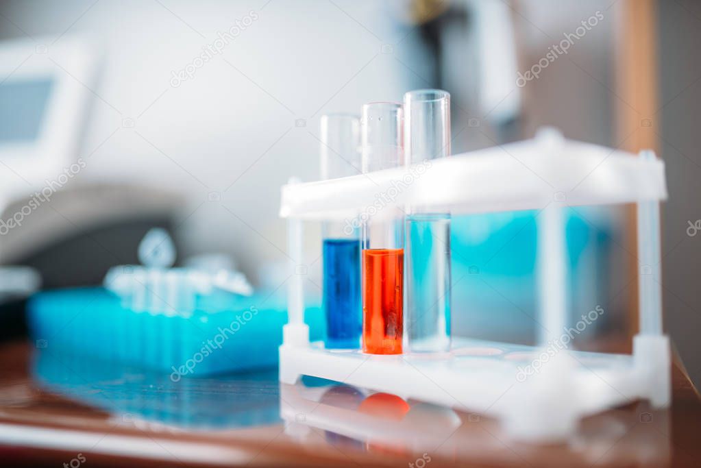 laboratory tests in glass flasks, closeup. Chemical reagents in medical lab