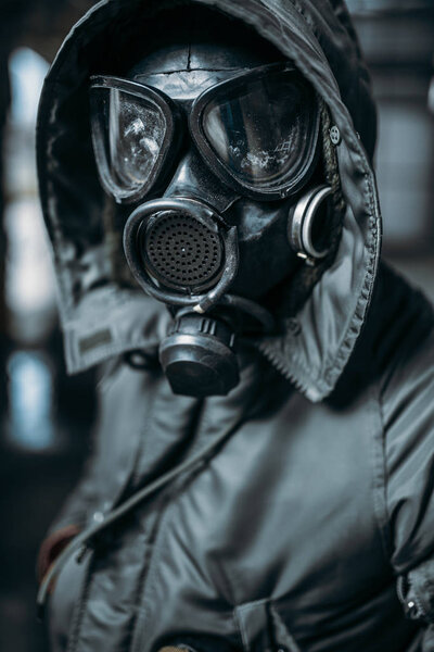 stalker concept, male person in gas mask, radiation danger. Post apocalyptic lifestyle, doomsday