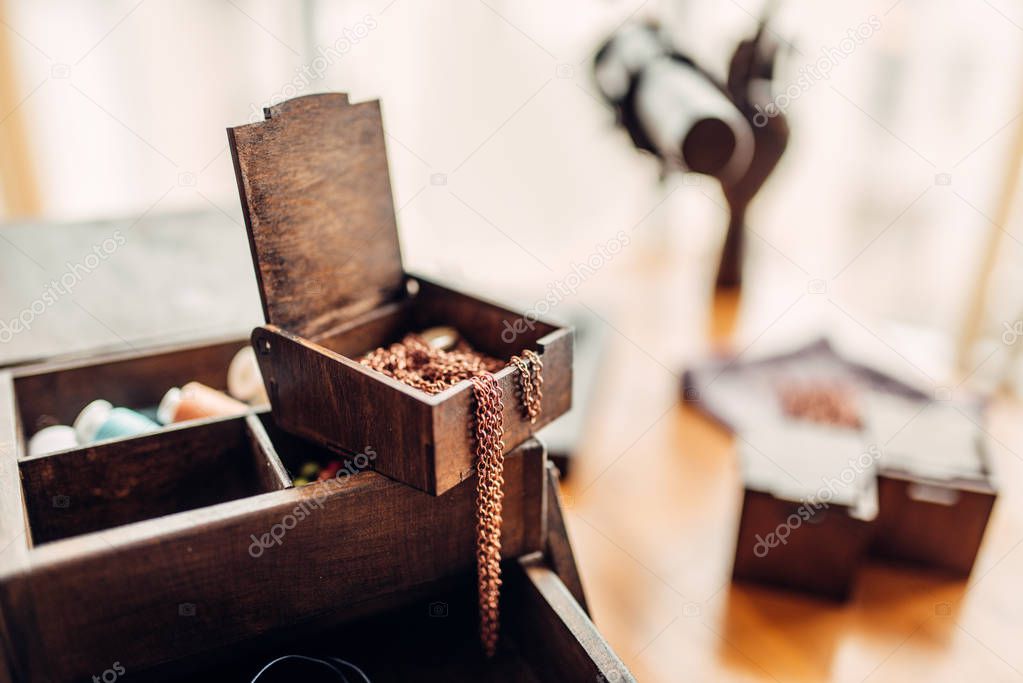 needlework accessories, little metal rings in wooden box, handmade jewelry
