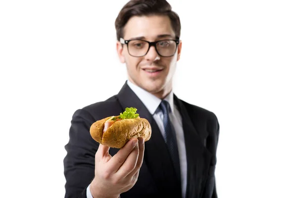 Joven Hombre Negocios Corbata Traje Negro Comiendo Hot Dog Aislado —  Fotos de Stock