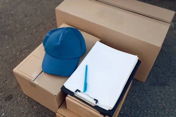 Parcel Boxes Cap Notebook Delivery Service Concept Delivering Business Nobody — Stock Photo, Image