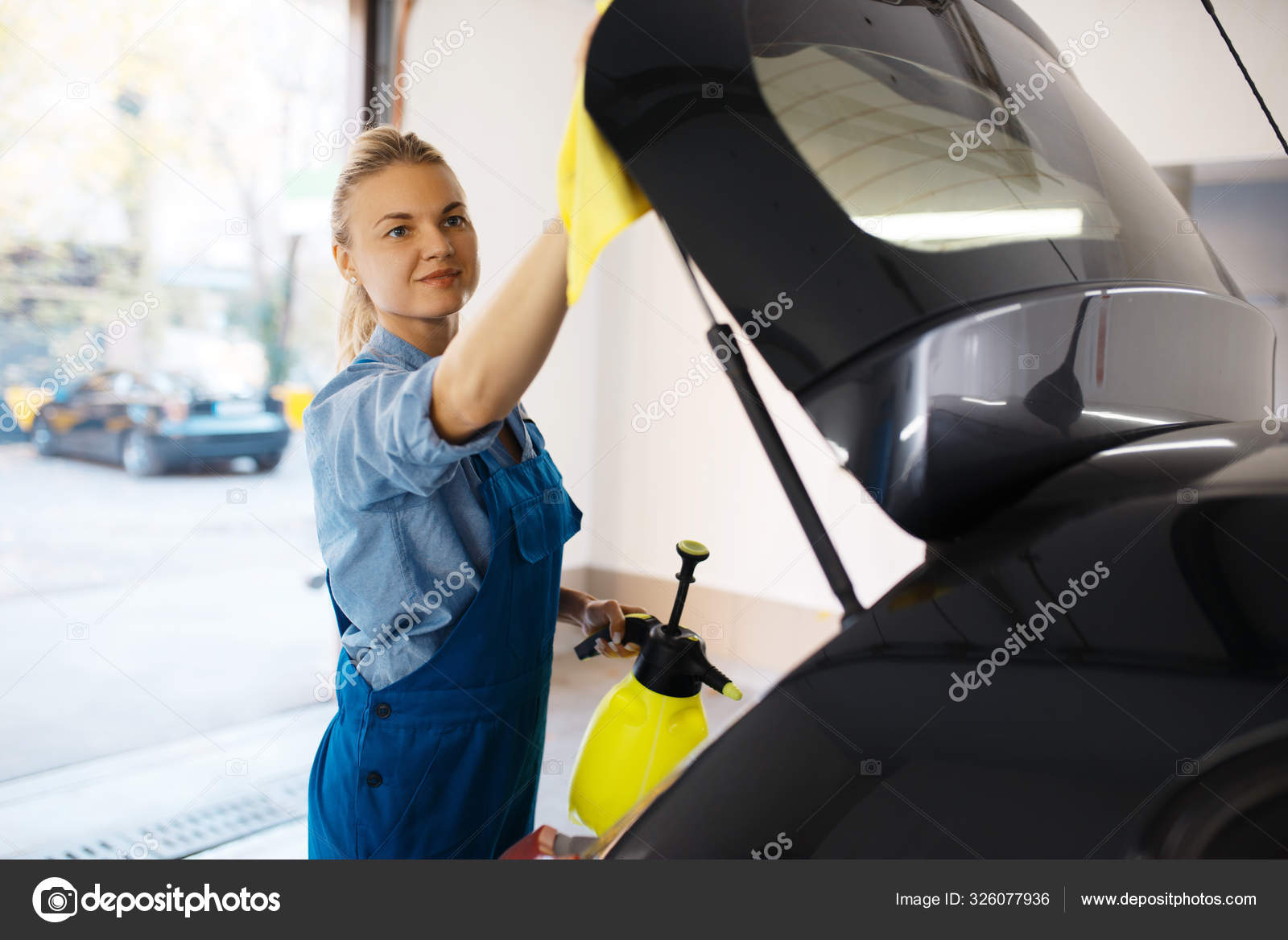 Woman wipes car interior with rag, hand auto wash Stock Photo by NomadSoul1