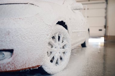 Auto in foam, car wash service, nobody. Automobile on carwash station, car-wash business concept