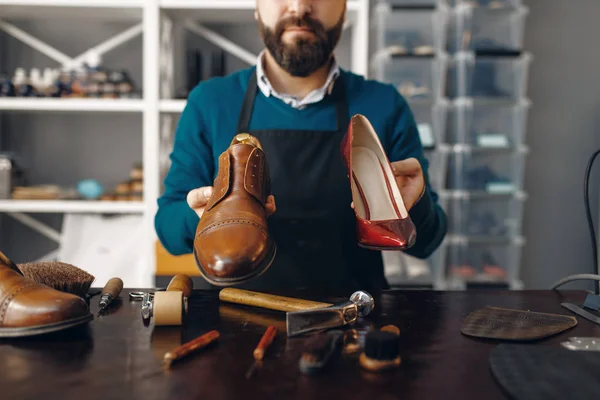 Bootmaker Shows Repaired Shoes Footwear Repair Service Craftsman Skill Shoemaking — Stock Photo, Image