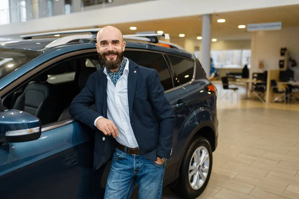 Smiling Man Poses Automobile Car Dealership Customer New Vehicle Showroom — Stock Photo, Image