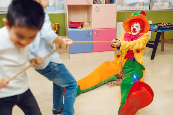 Funny Clown Joyful Little Boys Playing Tug War Together Birthday — Stock Photo, Image