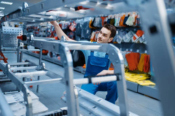 Male Worker Uniform Holds New Aluminum Stepladders Tool Store Department — Stock Photo, Image