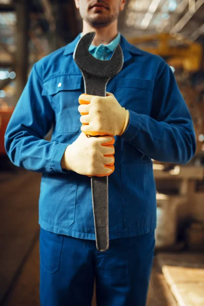 Male Worker Uniform Holds Large Wrench Factory Industrial Production Metalwork — Stock Photo, Image
