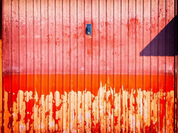 Red Rotten Peeling Garage Door Stock Photo