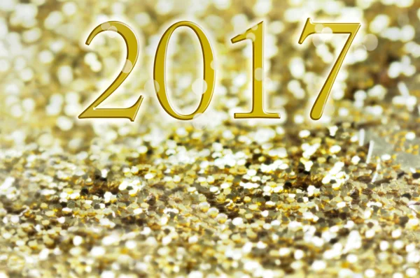 Новый 2017 год на золотых блестках — стоковое фото