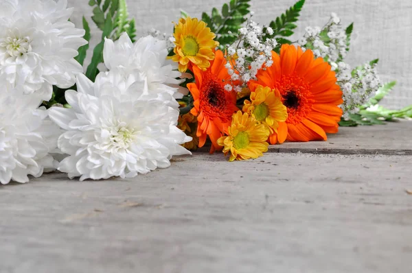 Flowers on wooden background — Stock Photo, Image