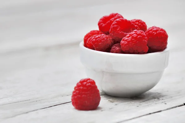 Raspberries on little bowl — Stock Photo, Image