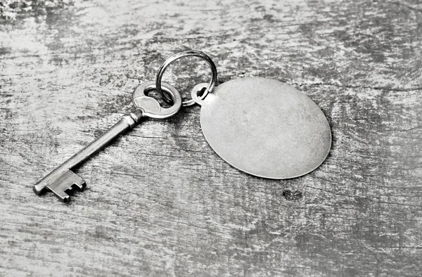 Old metal key in a ring — Stock Photo, Image
