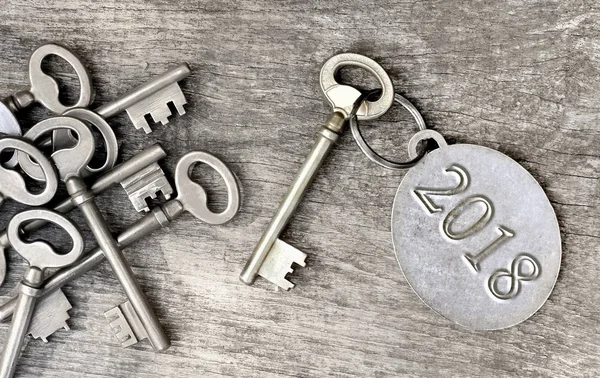 Old  key and 2018 written on ring — Stock Photo, Image