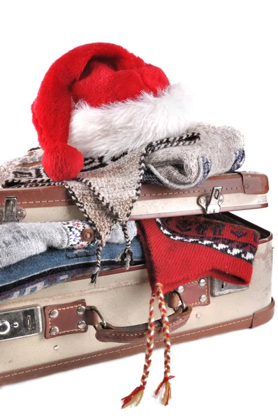 Christmas cap on suitcase — Stock Photo, Image