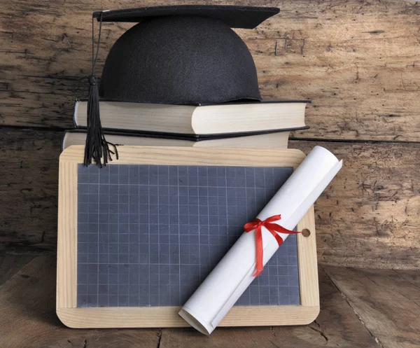 Dilpoma, slate, hat and books — Stock Photo, Image