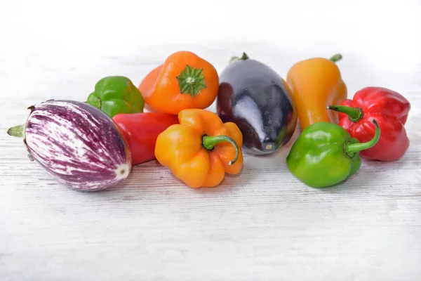 Collection Colorful Vegetables Peppers Eggplants White Table — Stock Photo, Image