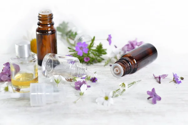 Bottles Essential Oil Colorful Petals Flowers White Table — Stock Photo, Image