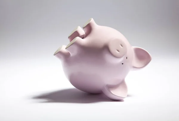 Pink piggy bank upside down — Stock Photo, Image