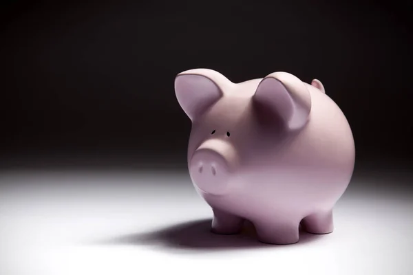 Piggy bank on black — Stock Photo, Image