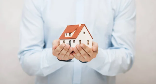 Small toy house in hands — Stock Photo, Image
