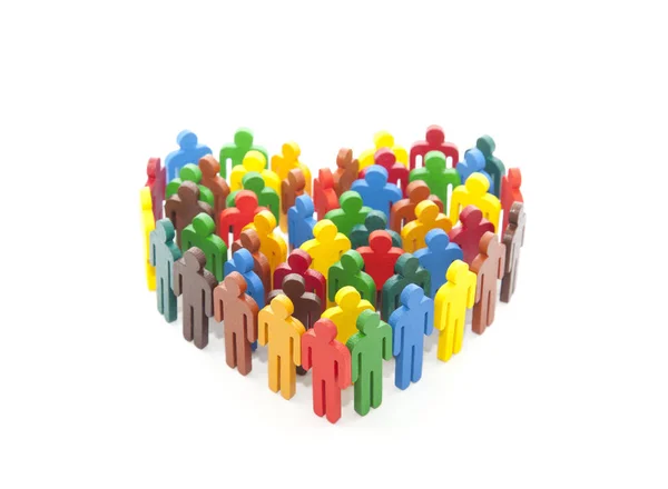 Grupo de pessoas coloridas pintadas figuras na forma de um coração — Fotografia de Stock