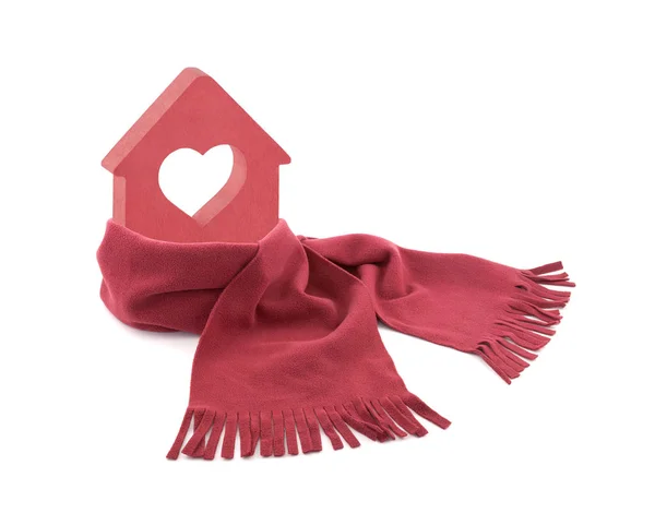 Small red house with heart wrapped in a scarf isolated on white — Stock Photo, Image