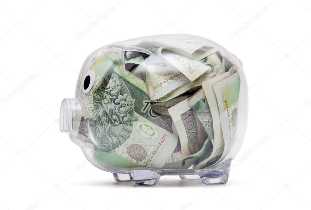 Transparent piggy bank with polish money. Clipping path included. 