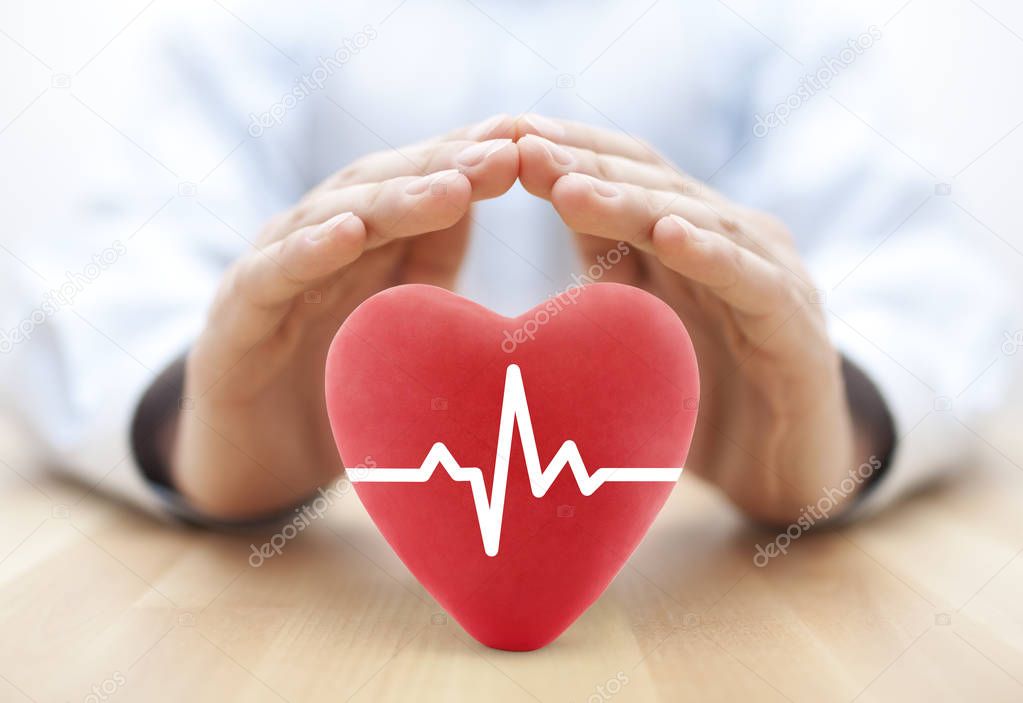 Heart pulse covered by hands. Health insurance concept 