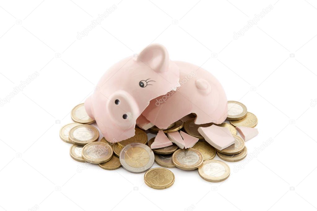 Broken piggy bank with Euro coins on white background with clipping path 