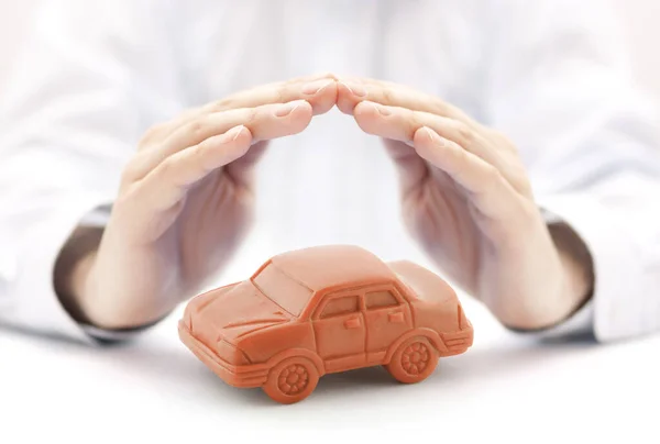 Car Insurance Concept Orange Car Toy Covered Hands — Stock Photo, Image