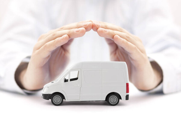 Transport white van car protected by hands
