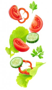 Isolated cut vegetables in the air clipart